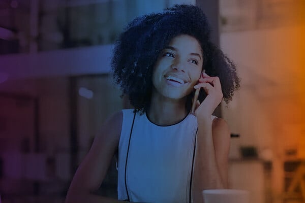 Woman smiling on phone using Mosaicx Engage